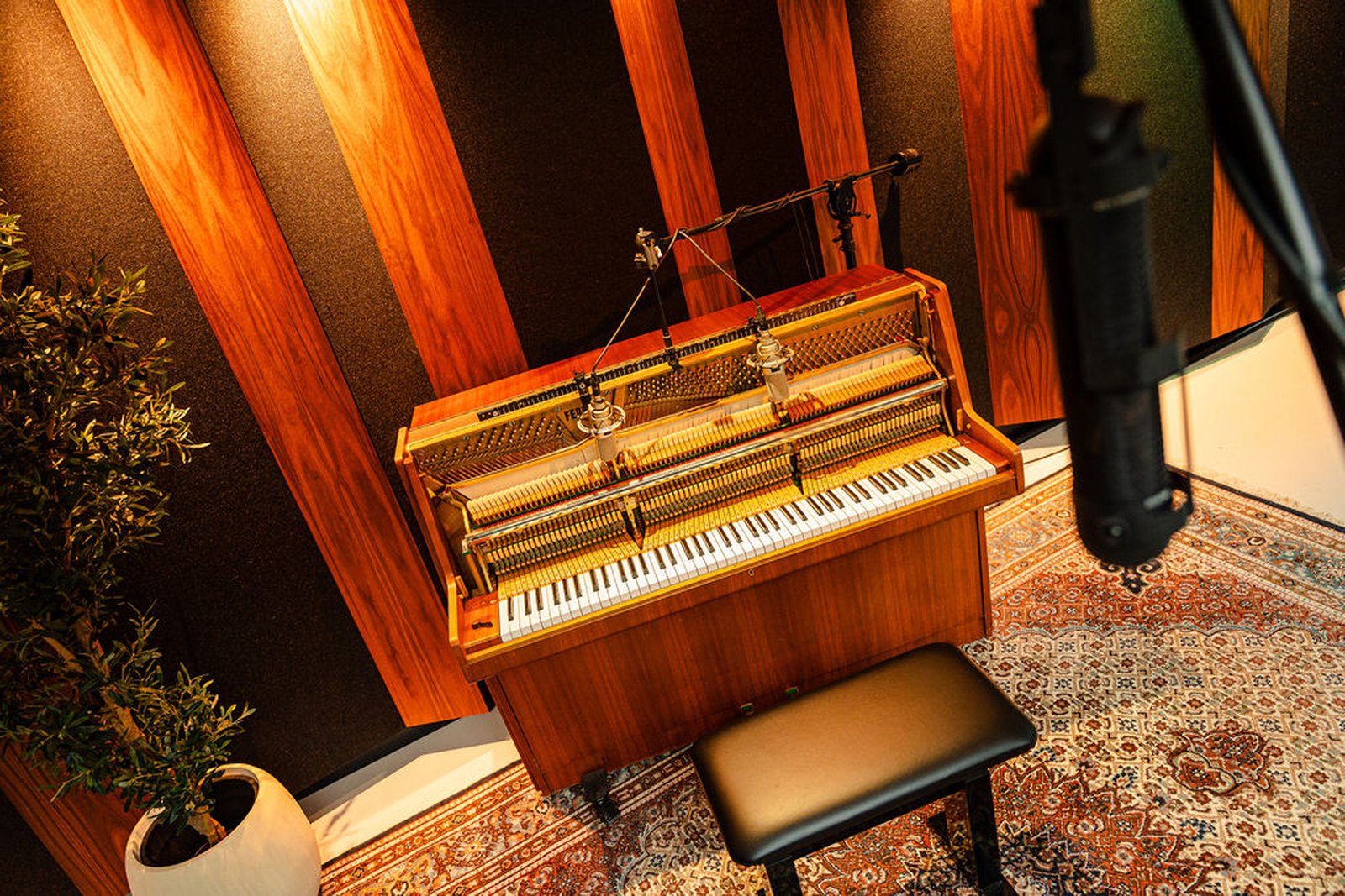 The upright piano miked over the strings in the studio